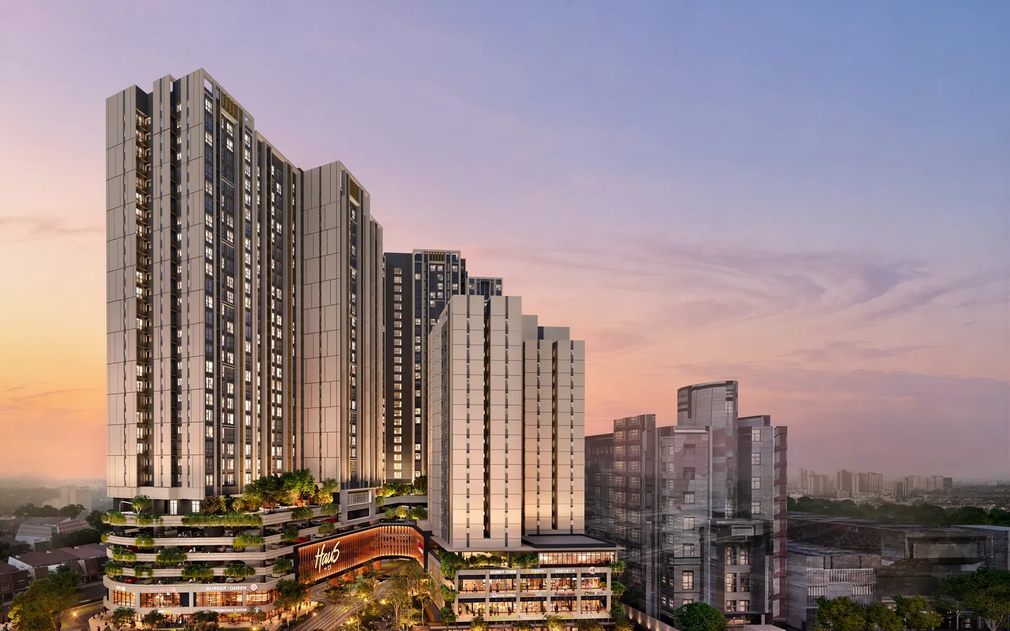 Haus On 15 pada waktu senja: dua menara kediaman di atas podium berteres yang menghijau, dengan Blok C di sebelah kanan.