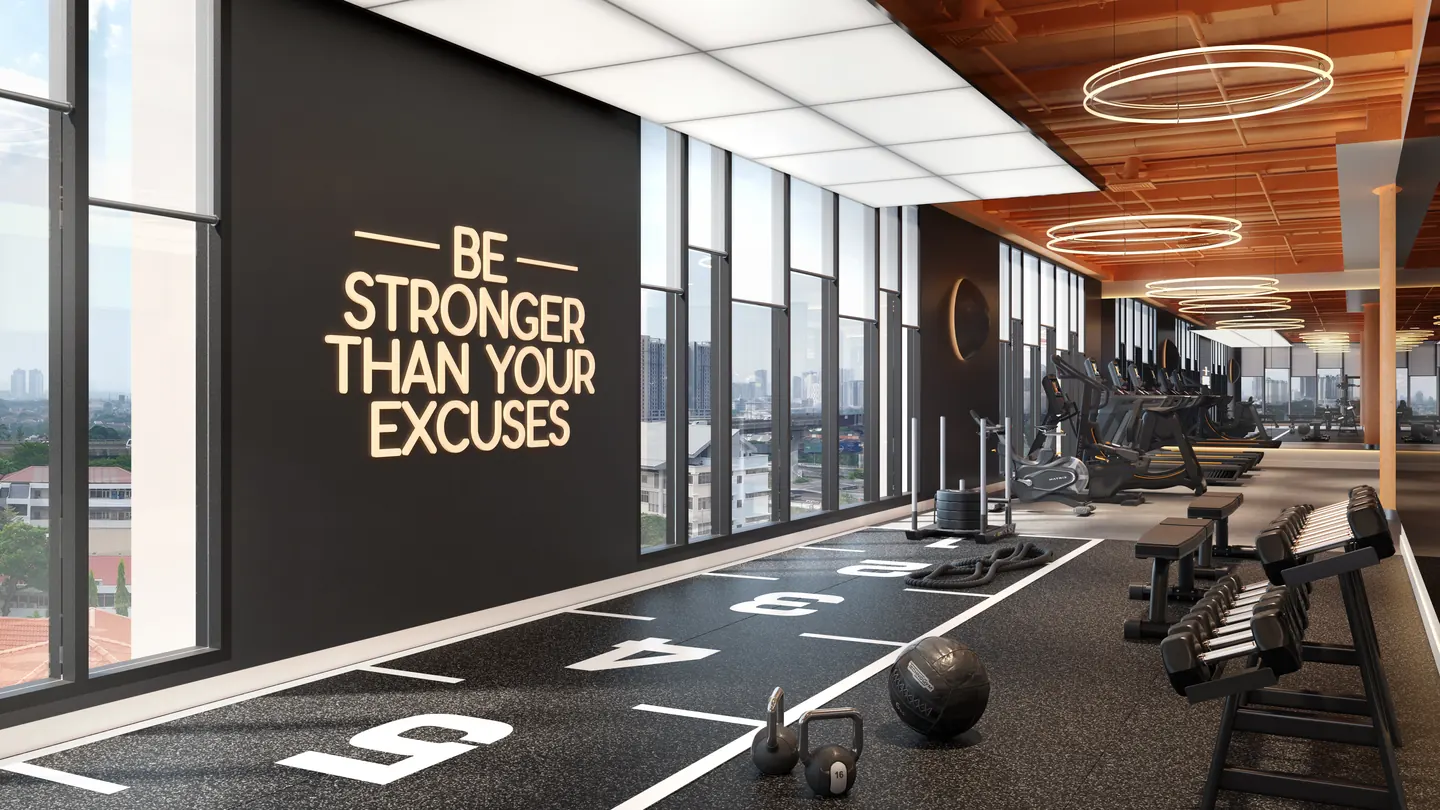 The gym: free weights, a training track and cardio machines along the windows.