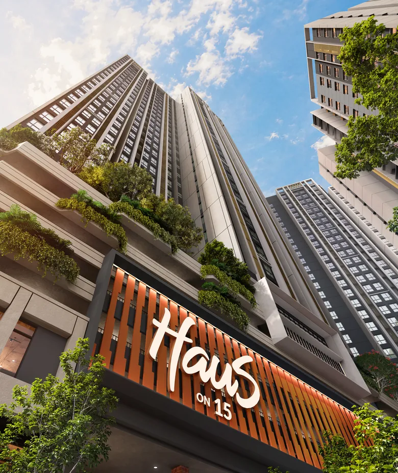 Looking up from the street, past planted terraces and the orange fins of the Haus On 15 sign, to the towers.